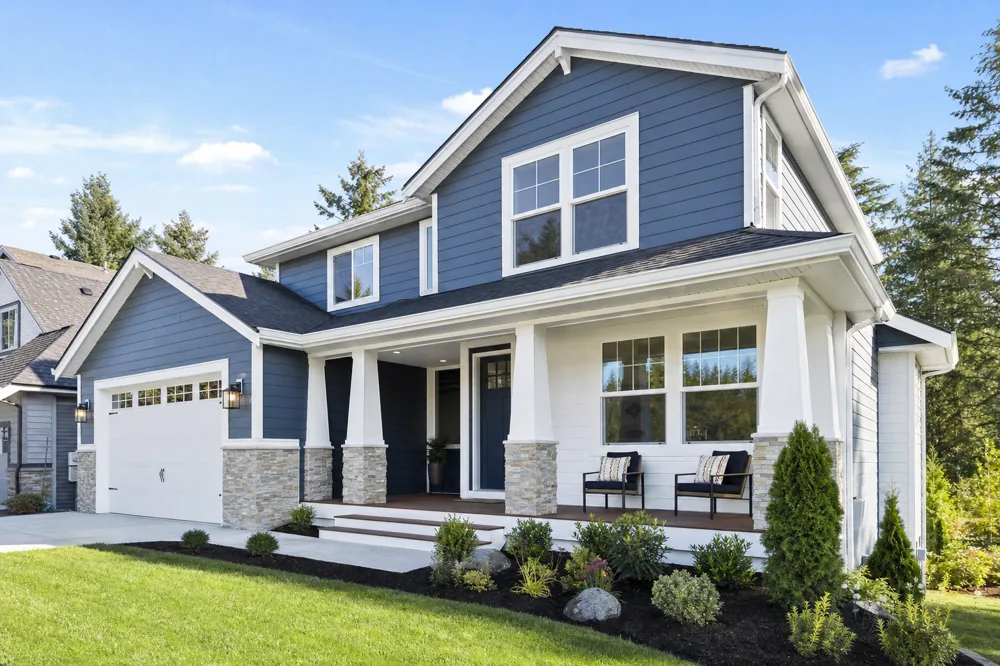 Freshly painted modern home exterior with clean siding and trim